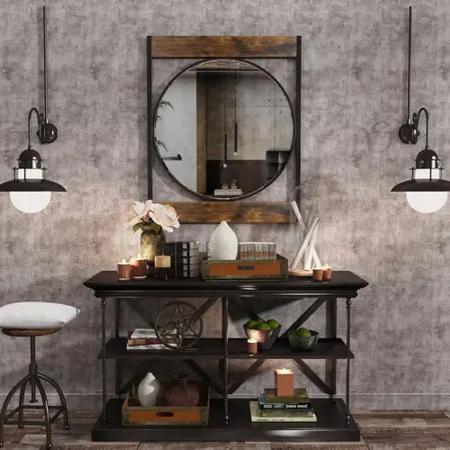 Miroir industriel vintage installé au-dessus d'une console en bois, avec des objets décoratifs dans un décor de style loft