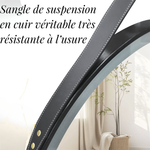 Détail de la sangle en cuir utilisée pour suspendre le chauffage miroir LED rond dans une salle de bain