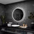 Miroir Rond LED sur Fond Effet Marbre Noir Modernité Assurée