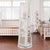Miroir sur pied pivotant avec rangement ouvert, compartiments pour bijoux et accessoires.