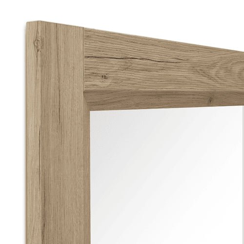 Vue de profil du cadre du miroir en bois chêne massif, détails soignés et robustesse